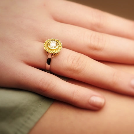 Cape diamond surrounded by yellow diamonds, set in white and yellow gold