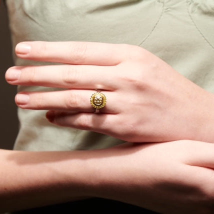 Cape diamond surrounded by yellow diamonds, set in white and yellow gold