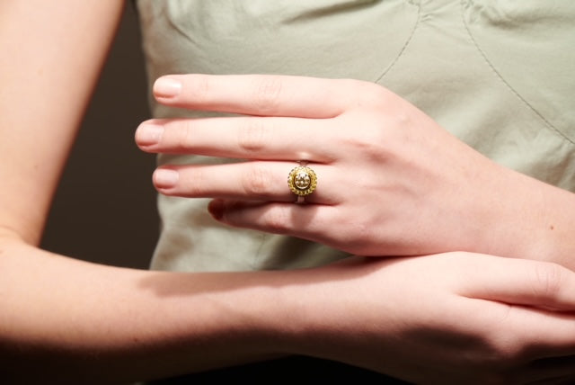 Cape diamond surrounded by yellow diamonds, set in white and yellow gold