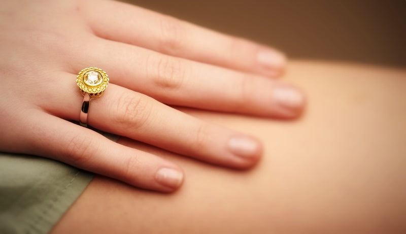 Cape diamond surrounded by yellow diamonds, set in white and yellow gold